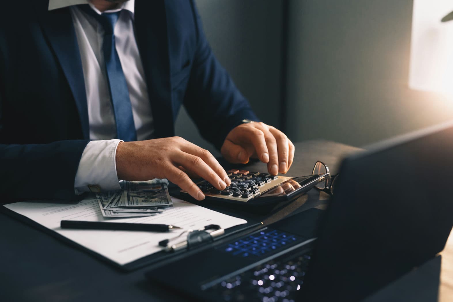 businessman-counting-earnings-money-financial-business-concept